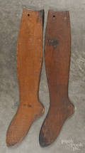 Two wooden sock stretchers