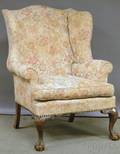 Chippendalestyle Upholstered Carved Mahogany Wing Chair with Clawandball Feet