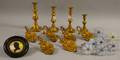 Four Brass Candlesticks a Set of Eight Opalescent Pressed Glass Curtain Tiebacks a Set of Six Empire Gilt Pressed Brass Strawberry