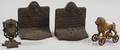 Cast Iron Lion Still Bank Pulltoy an Acornform Matchsafe and a Pair of Hiawatha Bookends