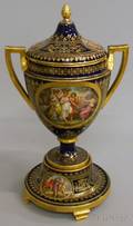 Austrian Gilt and Handpainted Genre Scenedecorated Cobalt Glazed Porcelain Covered Vase on Stand