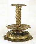 Dutch brass repousse decorated candlestick 17th c