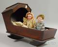 Two Small Bisque Head German Dolls in Hooded Cradle