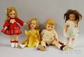 Four Composition and Hard Plastic Dolls