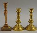 Three Antique Brass Pushup Candlesticks