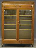Early 20th Century Carved Oak Twodoor Book Cabinet