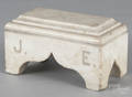 Marble sarcophagus doorstop