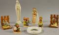 Seven Assorted GoebelHummel Ceramic Figures and a Flower Ring
