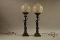 Pair of Classical Patinated Cast Bronze Figural Lamps with Frosted Glass Globe Shades