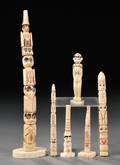 Six Carved Bone Totem Poles