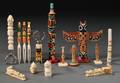 Fifteen Miscellaneous Wood and Ivory Totem Poles and Bottle Openers