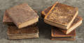 Six assorted leather bound books