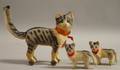 Toy Painted Clothclad Cat on Wheels and a Pair of Small Cats
