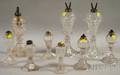 Nine Colorless Pressed Glass Fluid Lamps
