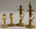 Pair of Brass Fluid Peg Lamps and a Pair of Palmer  Co London Brass Candle Hand Lamps