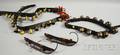 Three Leather Straps of Brass and Bellmetal Sleigh Bells and a Pair of Iron and Wood Ice Skates