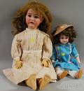 Two German Bisque Socket Head Dolls with Clothes
