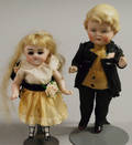 Two AllBisque Boy and Girl Dolls