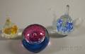 Two Caithness Art Glass Paperweights and a St Clair Teapotform Ring Holder Art Glass Paperweight