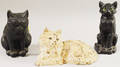 Two Painted Cast Iron Cat Doorstops and a Blackpainted Copperclad Seated Cat Doorstop