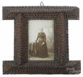 Tramp art carved frame