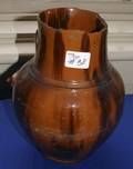Massive redware pitcher with a black manganese splash decoration