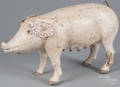 Carved and painted pig with a wrought iron tail and leather ears