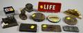 Twelve Mostly Early 20th Century Cast Metal Advertising Paperweights
