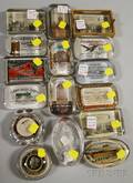 Nineteen Early 20th Century Glass and Cast Metal Advertising Paperweights