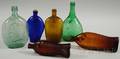 Six Colored Blown and Molded Glass Flasks and Bottles