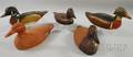 Four Painted Carved Wooden Duck Decoys and a Victor Painted Composition Duck Decoy