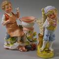 Painted Bisque Boy and Dove with Urn Figural Group and a Boy with Basket Figural Vase