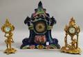 English Glazed Ceramic Cased Mantel Clock and Two Giltmetal Cherub Figural Table Clocks