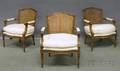 Set of Three Louis XVIstyle Upholstered and Caned Carved Walnut Fauteuils
