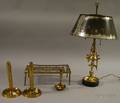 Three Brass Candlesticks a Table Lamp and a Trivet