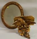Carved Giltwood American Eagle Bracket Wall Shelf and a Rococo Revival Giltgesso Oval Mirror