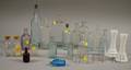 Nineteen Aqua and Colorless Molded Glass Bottles and a Pair of Milk Glass Vases