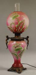 Late Victorian Figural Cast Metalmounted Painted and Floraldecorated Opaque Glass GonewiththeWind Kerosene Table Lamp