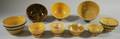 Eight Banded Yellowware Kitchen Bowls and a Glazed Spongedecorated Yellowware Bowl