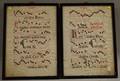 Pair of Framed Handwritten Music Manuscript Leaves on Vellum