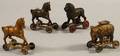 Four Painted Cast Iron Animal Figural Still Banks on Wheels