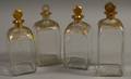 Four Giltdecorated Colorless Blown Glass Decanters
