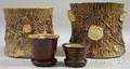 Two Rockingham Glazed Stoneware Tree Stumpform Planters and Two Small Flowerpots
