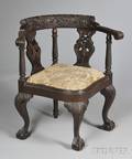 Late Victorian Carved Mahogany North Wind Roundabout Chair with Ballandclaw Feet