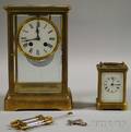 Two Brass and Beveled Glass Clocks