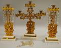 Threepiece Giltmetal Figural and Marble Base Girandole Set with Prisms and a Pair of Framed Cut and Shaped Lithographed Paper Duck