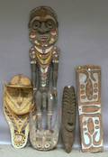 Four Papua New Guinea Basketry and Carved Wood Masks and Sculptures