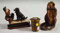 Two Painted Cast Iron Banks and a Seated Monkey Doorstop