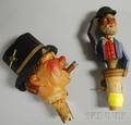 Two SwissGerman Carved and Painted Wood Figural Bottle StoppersPourers