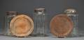 Three Blown Glass Storage Jars and Two Wooden Trenchers